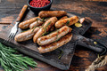 Bildunterschrift: Umfragen zufolge gehören bei sieben von zehn Personen Bratwürste beim Grillen einfach dazu. Foto: Vladimir/stock.adobe.com/akz-o