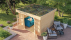 Bildunterschrift: Das Gartenhaus „Flora“ von Karibu fügt sich durch seine Dachbegrünung besonders natürlich in den Garten ein. Foto: Karibu Holztechnik GmbH/akz-o