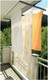 Bildunterschrift: Ein Deckentrockner, In- oder Outdoor, spart Platz und verschwindet nach Gebrauch in einem stilvollen Deckenprofil. Foto: Juwel/akz-o